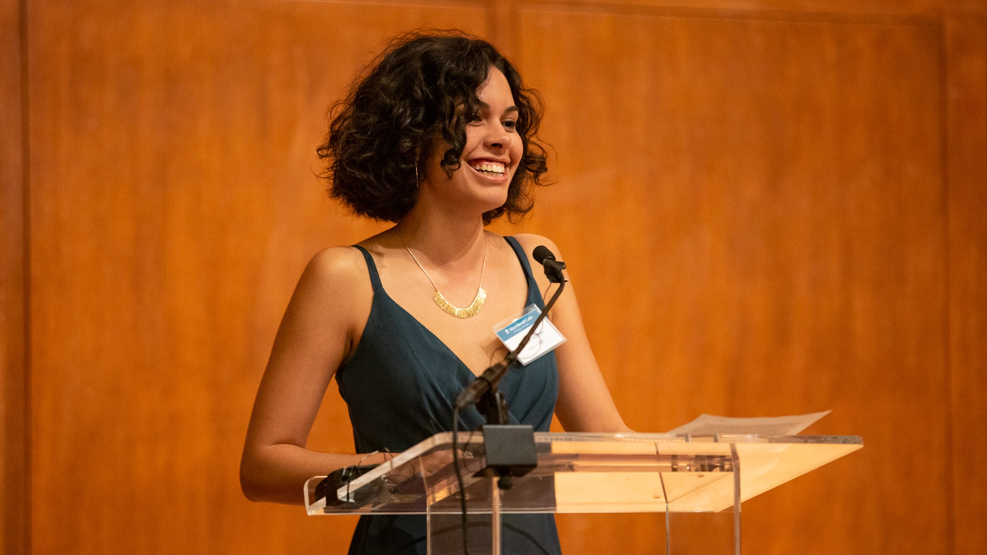 Ashton Martin gives a speech at a podium