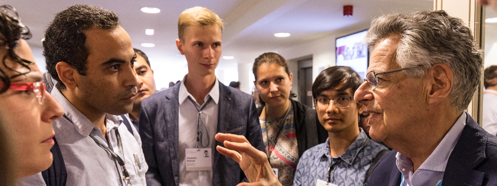 Vladimir Petrov with laureate Myron Scholes and other young economists.