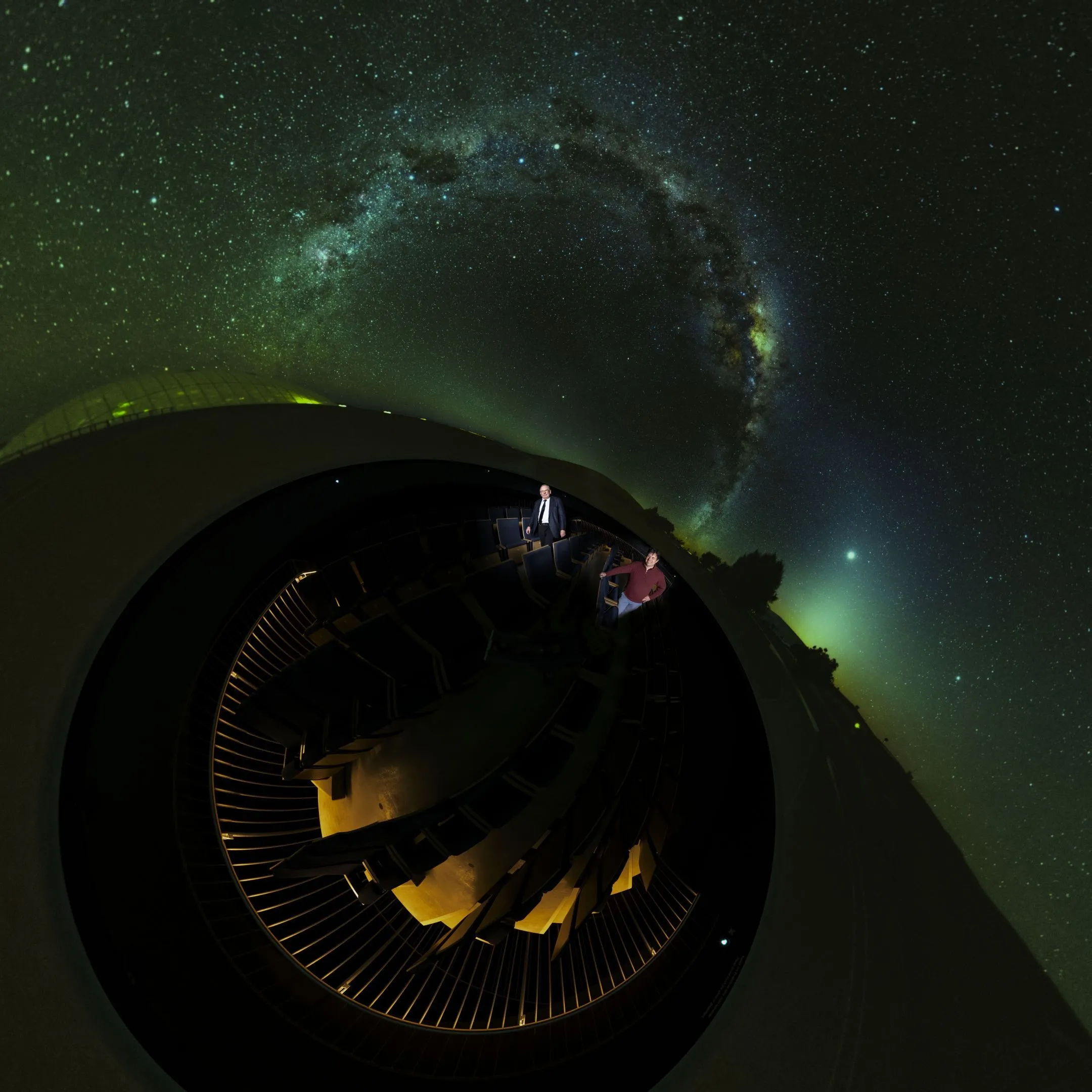 Genzel and a colleague stand in an observatorium.