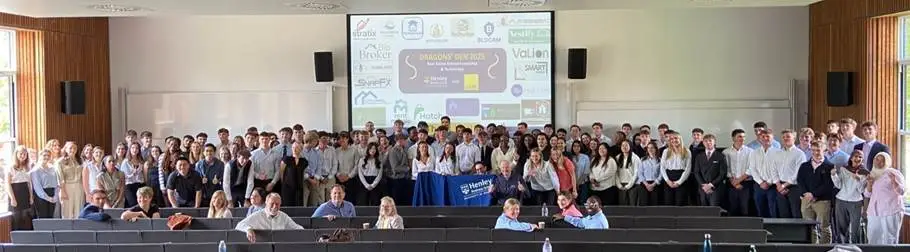 A
  group
  of
  people
  standing
  in
  front
  of
  a
  large
  screen
  Description
  automatically
  generated