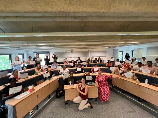 A
  group
  of
  people
  in
  a
  lecture
  hall
  AI-generated
  content
  may
  be
  incorrect.