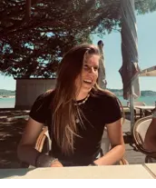 A
  person
  sitting
  at
  a
  table
  AI-generated
  content
  may
  be
  incorrect.