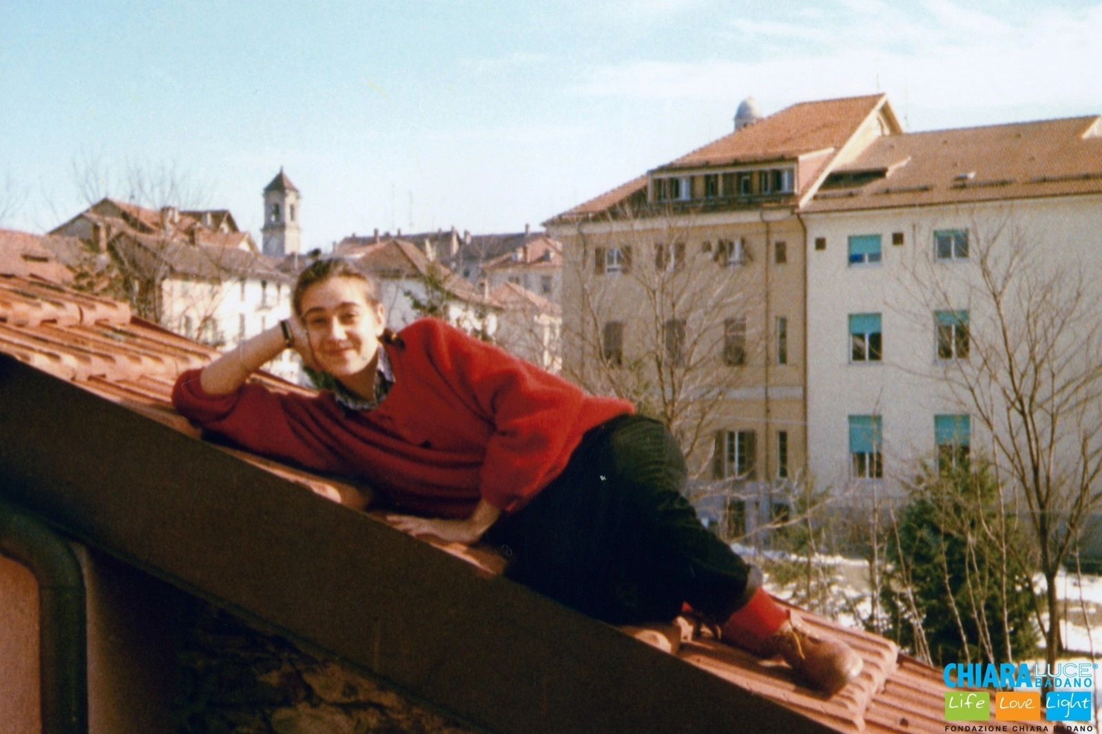 Chiara Badano smiling on a rooftop