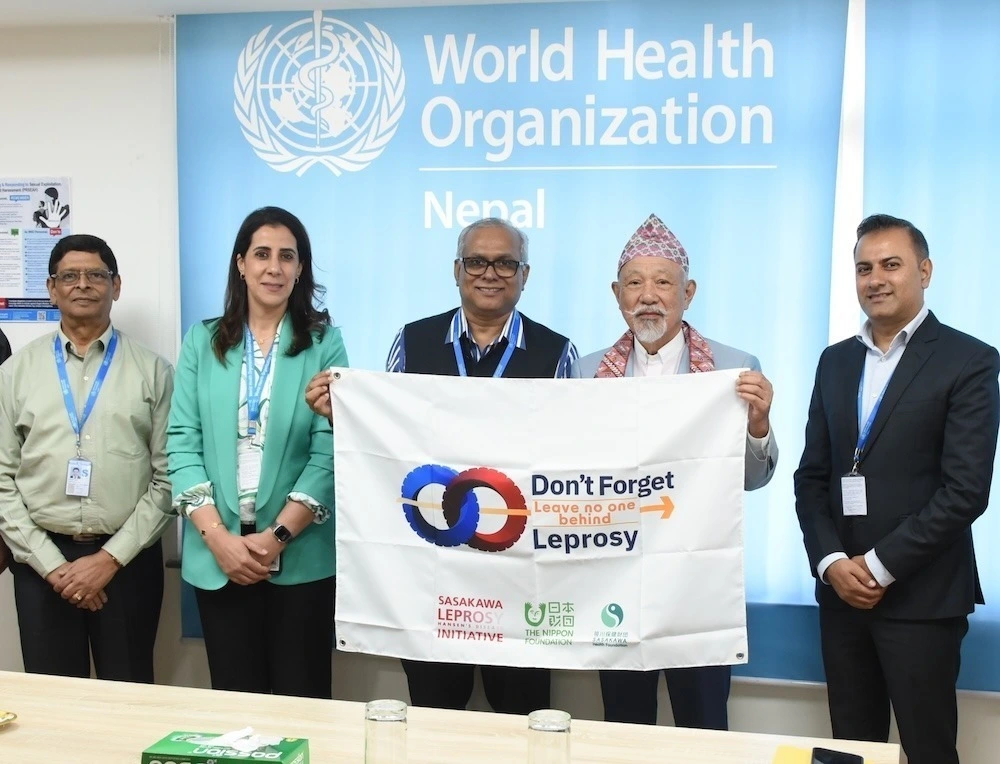 Yohei Sasakawa with Dr Rajesh Sambhajirao Pandav (center), WHO Representative to Nepal.