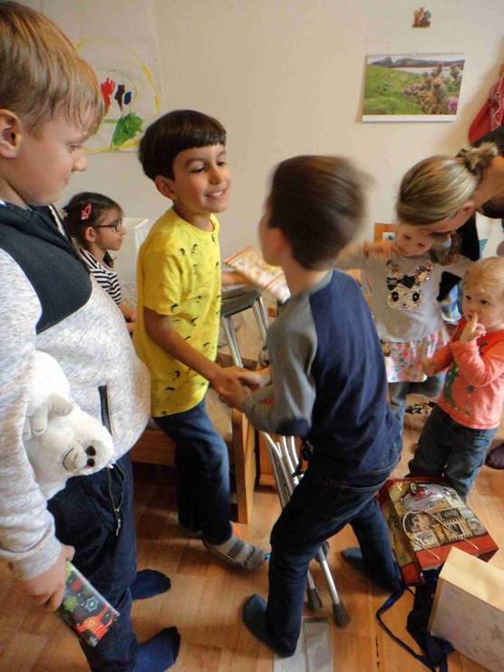 Rick’s grandson, Konrad, shaking hands with friends at the celebration of his eighth birthday