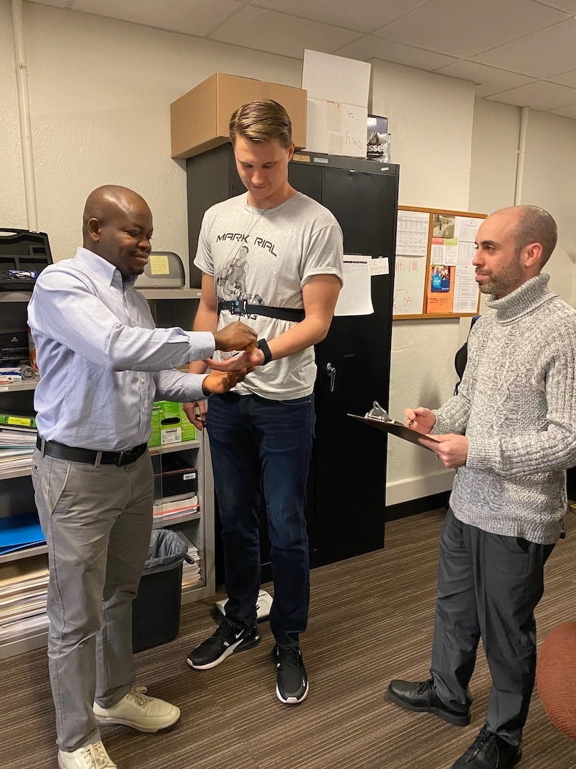 JohnBosco setting up a research participant at the MER (Mood and Emotion Regulation) lab, as Dr. Yaroslavsky looks on